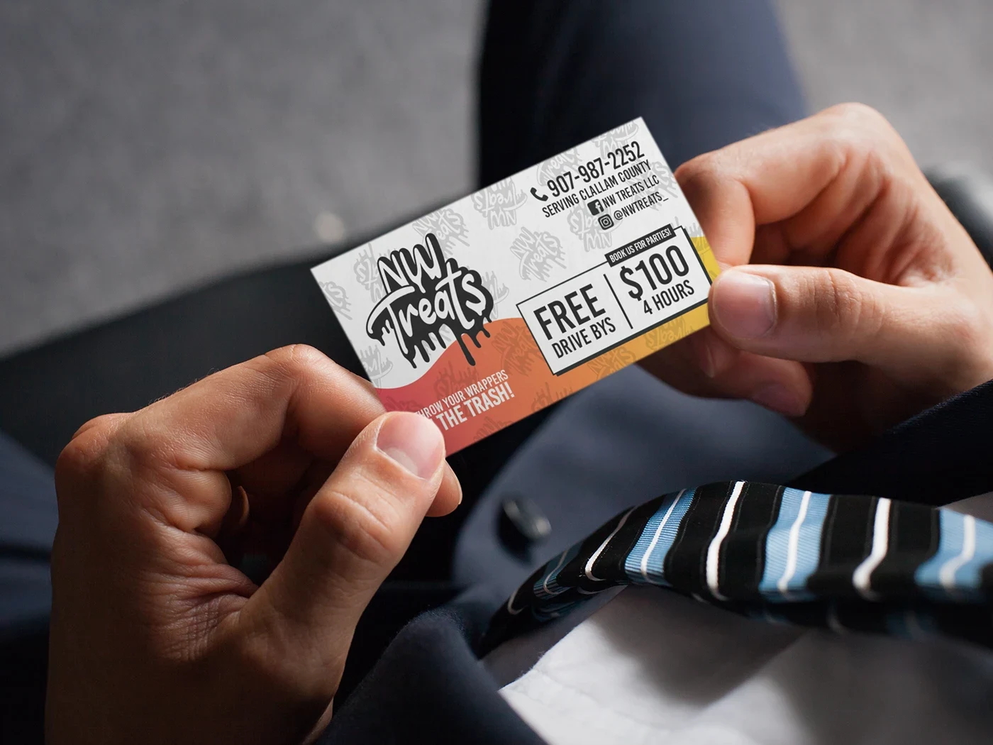 NW Treats business card design presented in a hand held card mockup